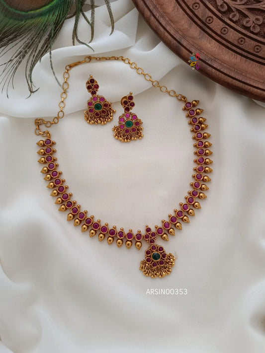 Kemp with Gold Bead Necklace