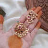 Trendy peacock multi stone pearl pendant