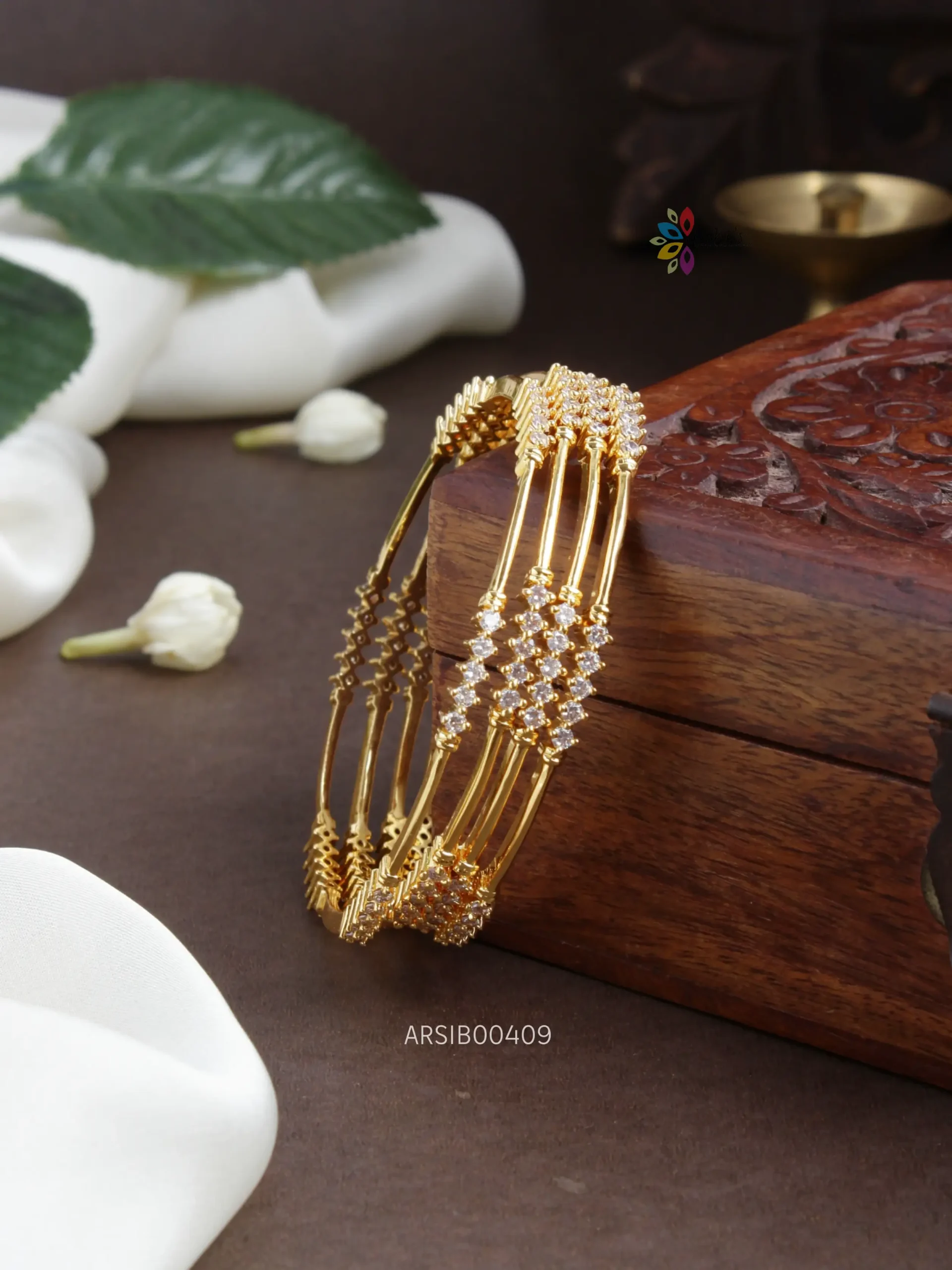 Gold white stone on sale bangles designs