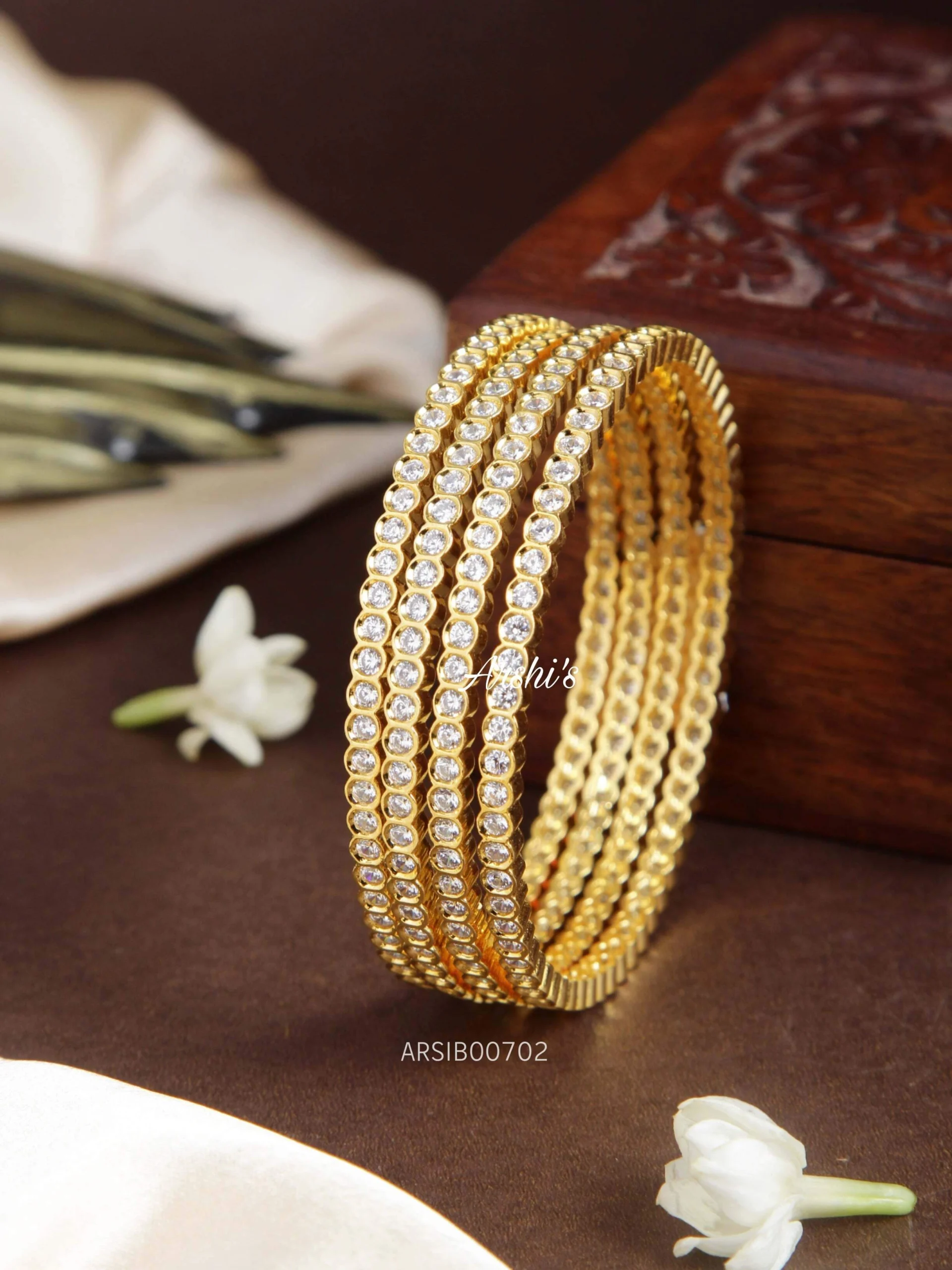 Four gold on sale bangles design